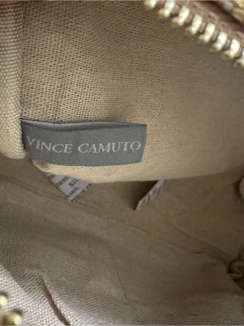 Vince Camuto gold woven canvas metallic cosmetic Bag with starfish Tassel charm.